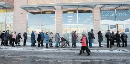  ?? RYAN REMIORZ
THE CANADIAN PRESS ?? Seniors 85 and over line up for their shots at a COVID-19 vaccinatio­n clinic Friday in Laval, Que.