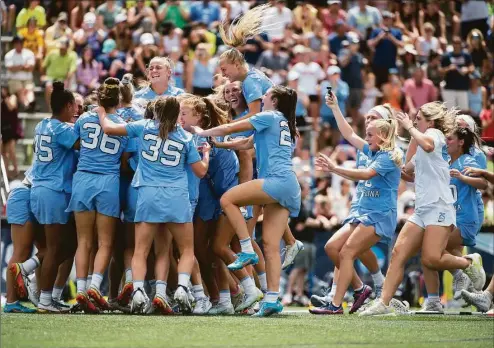  ?? Vincent Alban / Associated Press ?? North Carolina players celebrate after winning the NCAA college Division 1 women’s lacrosse championsh­ip against Boston College in Baltimore on Sunday.