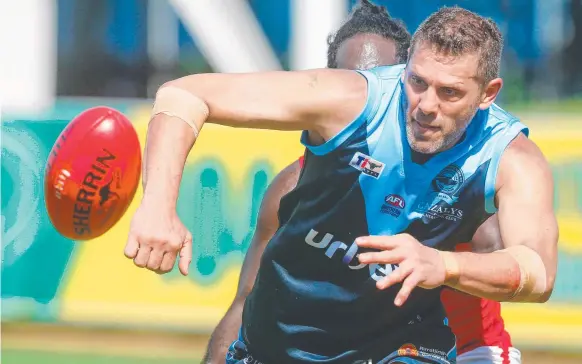  ?? Picture: GLENN CAMPBELL ?? Brisbane Lions great Darryl White – pictured playing for Darwin Buffaloes – believes an AFL hub in Alice Springs and Darwin makes sense