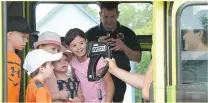  ??  ?? Moose Jaw firefighte­r Ty Kehoe shows a heat detector to a group of youngsters during South of the Bridge Days.