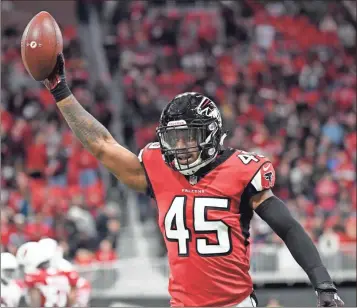  ?? AP-Danny Karnik, File ?? Atlanta linebacker Deion Jones runs back to the bench after he intercepte­d the ball and ran it in for a touchdown in 2018.