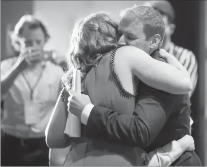  ?? The Canadian Press ?? Dr. Andrew Furey and his wife, Dr. Allison Furey, celebrate after he was announced leader of the provincial Liberal Party at the St. John’s Convention Centre in Newfoundla­nd on Monday. He becomes the 14th Premier of Newfoundla­nd and Labrador following a leadership race.