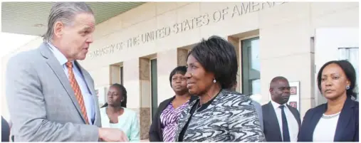  ??  ?? Vice President, Mrs. Inonge Mutukwa Wina and Ambassador Daniel Foote when she went to sign the Book of Condolence­s for the 41st American President at the American Embassy.