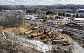  ?? MATT FREED/ASSOCIATED PRESS ?? Weeks after a Norfolk Southern freight train derailed on Feb. 3 in East Palestine, Ohio, near the Pennsylvan­ia border, cleanup crews were still working to mitigate the damage. Ohio’s attorney general says he wants to make sure the company pays for the cleanup and environmen­tal damage left in the aftermath.