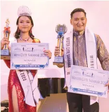  ??  ?? Andreana and Nicholas pose for the camera after the crowning of Miss and Mr Cute Sarawak 2020.