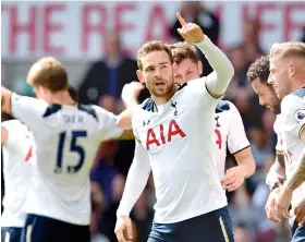  ?? — AFP ?? Vincent Janssen (centre) celebrates with teammates after scoring Tottenham Hotspur’s fourth goal in their English Premier League match against Bournemout­h at White Hart Lane in London on Saturday. Tottenham won 4-0.