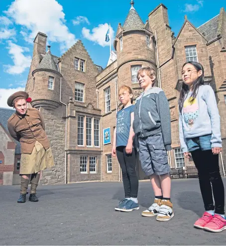  ?? Picture: Alan Richardson. ?? Above, The Black Watch Castle Museum in Perth is participat­ing in the festival. Picture shows staff member Alastair Macfarlane and visitors Cerys, Koby and Imogen.