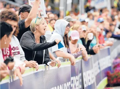  ?? SPECIAL TO THE COURANT
More coverage in
Sports,
CLOE POISSON PHOTOS/ ?? Spectators cheer and ring cowbells Saturday near the finish line at the Hartford Marathon.
Page 1.