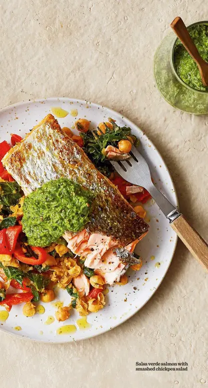  ??  ?? Salsa verde salmon with smashed chickpea salad