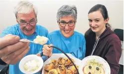  ?? Picture: Mhairi Edwards. ?? Celebratin­g World Porridge Day at Birnam Arts are Ron Convery and Marilyn Howe with helper Lizzie Small.
