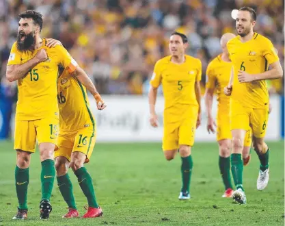  ?? LOTTERY: Australian captain Mile Jedinak celebrates scoring a goal against Honduras. ??