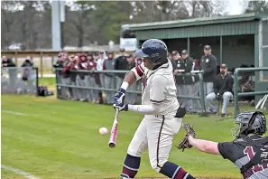  ?? Staff photo by Hunt Mercier ?? ■ Texas A&M University-Texarkana Eagles’ Jaylan Prince hits the ball into the outfield to bring in runners to home plate during a game against the Crusaders at George Dobson Field on Friday in Texarkana, Texas.