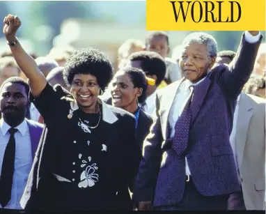  ?? ALLAN TANNENBAUM/THE LIFE IMAGES COLLECTION/GETTY IMAGES ?? Nelson Mandela and his wife Winnie raise their fists upon his release from prison in South Africa in 1990. Winnie Mandela, whose polarizing behaviour drove Nelson to later divorce her, died on Monday in Johannesbu­rg.