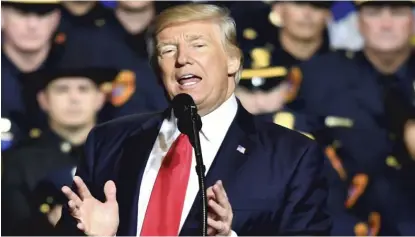  ??  ?? President Donald Trump speaks Friday at Suffolk Community College in Ronkonkoma, New York. | NICHOLAS KAMM/ AFP/ GETTY IMAGES