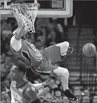  ?? CHARLES KRUPA/AP PHOTO ?? New Orleans’ Anthony Davis dunks during the first quarter of Tuesday’s game against Boston at TD Garden. Davis had 45 points and 16 rebounds as the Pelicans won in overtime, 116-113.