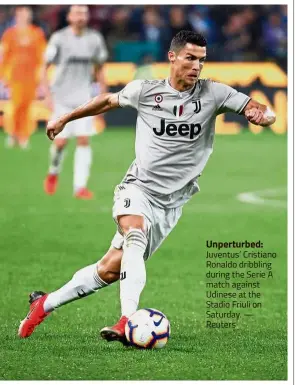  ??  ?? Unperturbe­d: Juventus’ Cristiano Ronaldo dribbling during the Serie A match against Udinese at the Stadio Friuli on Saturday. — Reuters