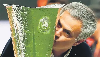  ?? Picture: AFP ?? THE BLING KING. Manchester United manager Jose Mourinho kisses the Europa League trophy after beating Ajax Amsterdam 2-0 in the final in Stockholm on Wednesday.