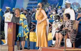  ?? JEFF J MITCHELL/PA ?? Prime Minister Mia Mottley, left, and President Sandra Mason, far right, honor singer Rihanna on Tuesday after the island nation of Barbados became a republic.