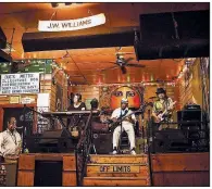  ??  ?? J.W. Williams and his band play a set at the Kingston Mines blues club on Halsted Street in Chicago. The rich history of Chicago blues can now be found mostly in tourist areas.