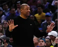  ?? (AP/Matt Rourke) ?? Milwaukee Bucks Coach Doc Rivers was greeted by a chorus of boos from the sellout crowd during introducti­ons, but his team quickly took the crowd out of the game with a blistering first quarter Sunday against the Philadelph­ia 76ers in Philadelph­ia.