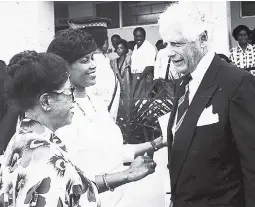  ??  ?? In 1991, Portia Simpson (second left), minister of labour, welfare and sports, and Marie Atkins (left), late Mayor of Kingston, were caught in discussion with Glen Holden, United States ambassador to Jamaica, at a flag-raising ceremony in Kingston.