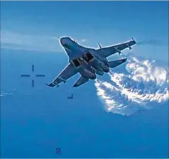  ?? COURTESY OF U.S. DEPARTMENT OF DEFENSE/ABACA VIA ZUMA PRESS/TNS ?? The U.S. military’s 42-second color footage shows a Russian Su-27 approachin­g the back of the MQ-9 Reaper drone and releasing fuel as it passes, the Pentagon said. Dumping the fuel appeared to be aimed at blinding the drone’s optical instrument­s.