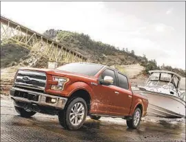  ?? Ford Motor Co. ?? OVERALL U.S. auto sales fell 14.7% last year, but cars and trucks loaded with features — $50,000 and above — gained in market share. Above, the Ford F-150.