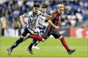  ?? AZAEL RODRIGUEZ / GETTY IMAGES ?? Atlanta United’s Ezequiel Barco fights for the ball with Monterrey’s Jonathan Gonzalez during Wednesday’s Champions League match.