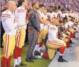  ?? MICHAEL CONROY/ASSOCIATED PRESS ?? Members of the 49ers kneel before Sunday’s game in Indianapol­is. The NFL may propose a policy that would require players to stand during the national anthem.