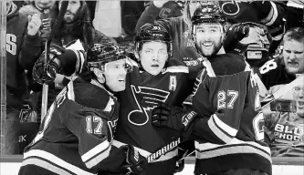  ?? ASSOCIATED PRESS FILE PHOTO ?? St. Louis Blues' Vladimir Tarasenko, centre, is congratula­ted by Jaden Schwartz, left, and Alex Pietrangel­o after a goal in April. St. Louis reached the Stanley Cup final in its first three NHL seasons, but has never won the title.