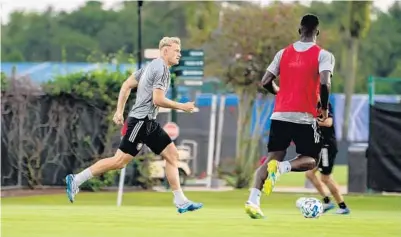  ?? COURTESY OF MLS ?? Orlando City defender Robin Jansson, left, and the Lions’ defenders expect to be tested early in the MLS is Back Tournament.