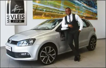  ??  ?? Dealer Principal Tebatso “Vleis” Manyama proudly standing with one of their MAD VLEIS Special Edition Polo Vivos on their showroom floor.