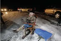  ?? AP Photo/Rick Bowmer, File ?? ■ In this Jan. 5, 2016, file photo, Arizona rancher LaVoy Finicum holds a gun as he guards the Malheur National Wildlife Refuge near Burns, Ore. Finicum, one of the leaders of the armed takeover of the refuge, was later shot by state police officers after he fled an attempted police stop.