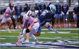  ?? KYLE FRANKO — TRENTONIAN PHOTO ?? Notre Dame’s Joe Meidling, right, reaches for the ball after winning a face off against Pennington’s Burke DeTurro, left, during a Mercer County Tournament boys lacrosse quarterfin­al game at Msgr. Walter Nolan Field in Lawrence on Saturday afternoon.