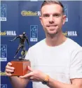  ??  ?? Top honour: Jordan Henderson shows off his Footballer of the Year award