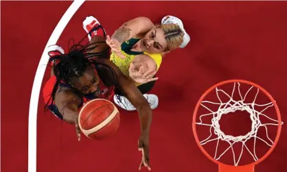  ?? - Pool/Getty Images ?? Sylvia Fowles of the USA goes up for a shot against Cayla George of Australia during the women’s Olympic basketball quarter-final at Saitama Super Arena. Photograph: Aris Messinis