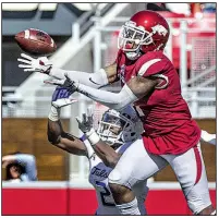  ?? NWA Democrat-Gazette/BEN GOFF ?? Arkansas defensive back Ryan Pulley intercepts a pass intended for Tulsa receiver Keylon Stokes on Oct. 20 at Reynolds Razorback Stadium in Fayettevil­le. Pulley and defensive back Kamren Curl were suspended Monday for Friday’s season-ending game at Missouri.