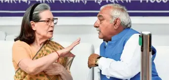  ?? ANI ?? Peaceful resolution: Congress Parliament­ary Party chairperso­n Sonia Gandhi in conversati­on with party leader Bhupinder Singh Hooda in New Delhi on Sunday.