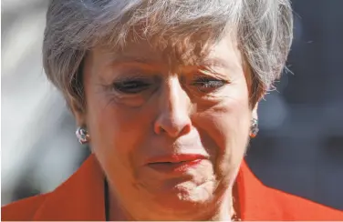  ?? Tolga Akmen / AFP / Getty Images ?? Prime Minister Theresa May announced that she will step down as Conservati­ve Party leader on June 7.