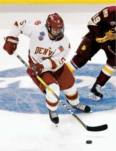  ?? NUCCIO DINUZZO / CHICAGO TRIBUNE ?? Denver forward Henrik Borgström, left, skates against Minnesota-Duluth center Dominic Toninato during the NCAA Frozen Four championsh­ip game on April 8, 2017, at the United Center. He signed Wednesday with the Blackhawks.