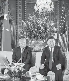  ??  ?? Trump (left) and Xi at the Mar-a-Lago estate in West Palm Beach, Florida. — AFP photo