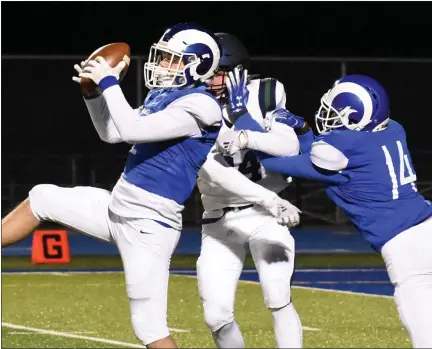  ?? JASON SCHMITT PHOTOS — FOR MEDIANEWS GROUP ?? Madison Heights Lamphere’s Jake Malak, left, intercepts a pass during the second half of his team’s 43-0 win over Cranbrook Friday.