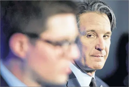  ?? CP PHOTO ?? Toronto Maple Leafs president Brendan Shanahan, right, looks over at the franchises newly-appointed general manager Kyle Dubas during a news conference in Toronto on Friday, May 11, 2018.