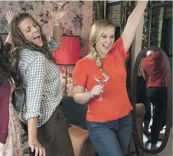  ?? STXFILMS ?? Amy Schumer, right, seen with Busy Philipps, returns to the big screen in I Feel Pretty. Schumer gains a new sense of confidence following a head injury that leaves her thinking she looks like a supermodel.