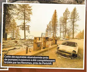  ??  ?? Cette décapotabl­eabandonné­e près de pompes à essenceaét­écomplètem­ent brûlée par les flammes, prèsdepark­hill.