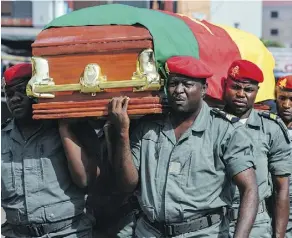  ?? AFP/GETTY IMAGES ?? Soldiers carry the coffin of one of four soldiers killed in violence in the English-speaking area of Bamenda.