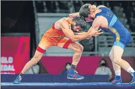  ??  ?? India's Ravi Dahiya in action against Zavur Uguev of Russia in men’s 57kg final final on Thursday.