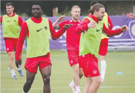  ?? DEREK VAN DIEST FILES ?? Alphonso Davies, left, who is starring with Bayern Munich in the German Bundesliga, and Samuel Piette of the Montreal Impact will be teammates again on Canada's national team in 2021. Canada hasn't played a game since losing 1-0 to Iceland in an exhibition contest a year ago.