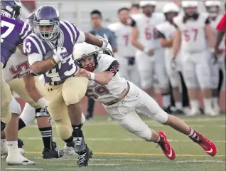  ?? Katharine Lotze/The Signal (See additional photos on signalscv.com) ?? (Above) Valencia’s Moises Haynes (43) dodges a tackle by Chaparral’s Jaxon Richards during a football game against on Friday. Valencia’s Mykael Wright (2) and teammate Zachary Semko celebrate a touchdown.