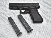  ?? RICH PEDRONCELL­I/AP 2017 ?? An appeals court has ruled on California’s high-capacity magazine ban. Above, a gun with two such magazines.